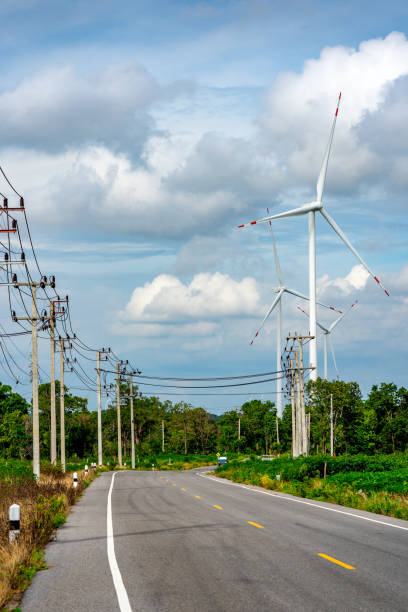 istock Wind turbine and blurred road for transport 1408039528