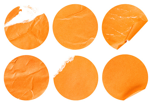 collection of six round orange stickers on a white isolated background