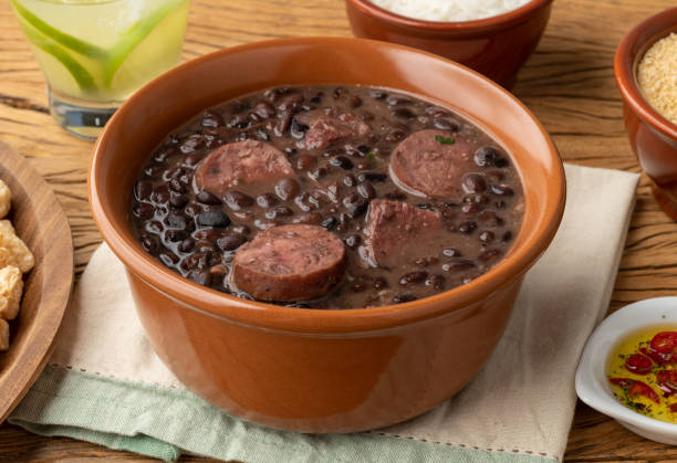 istock Typical brazilian feijoada with rice, caipirinha, farofa and cracklings 1408041066