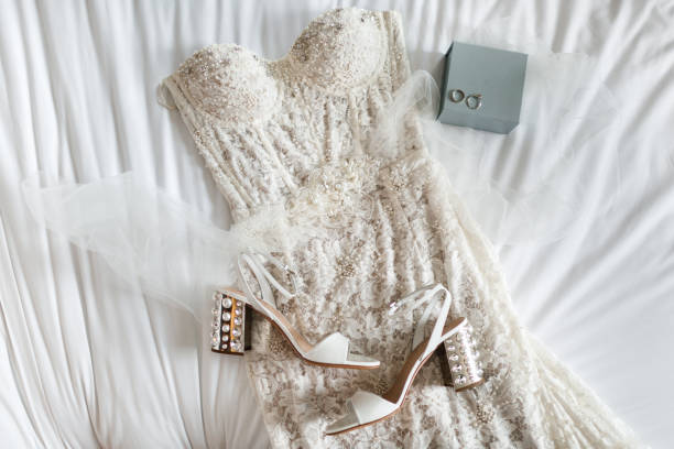 istock Wedding dress with beads on the bed 1408042229