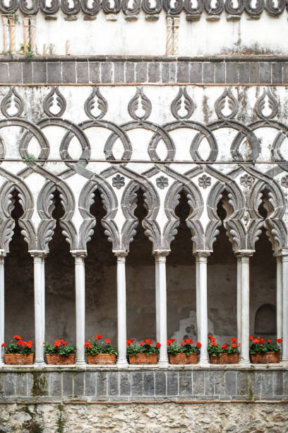 istock Indoor plants in flower pots stand between stone columns 1408042323