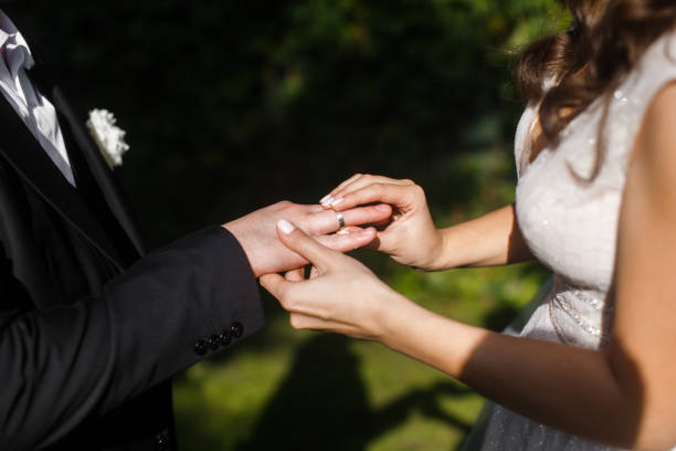 istock The bride wears a ring to the groom 1408043107