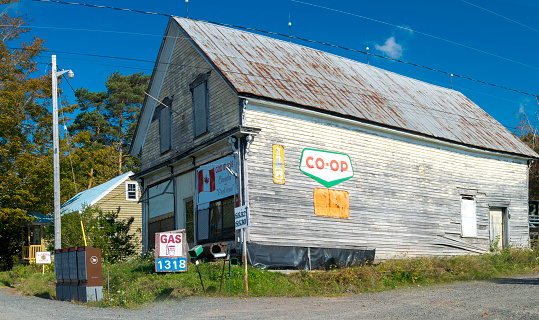 Earltown, Nova Scotia, Canada - September 27, 2014 : Abandoned Co-Op store in the rural Nova Scotia community of Earltown.\n\nCamera: Nikon D3300 & 18-55mm kit lens\nISO 100, 18mm, f/8, 1/160