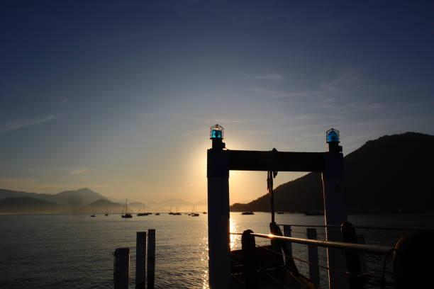 wooded bridge at itagua beach, ubatuba, during sunrise. - sao paulo south america marina southeastern region imagens e fotografias de stock