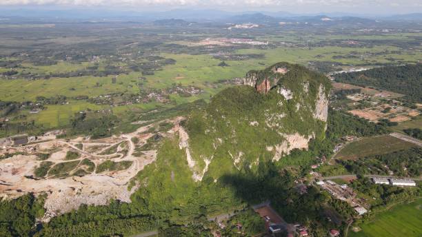 istock The Limestone Keteri Hill and The Surrounding Rice Paddy Fields 1408044478