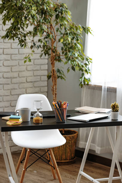 istock Office desk with stationery items and laptop 1408045850