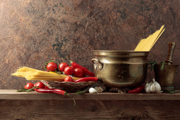 istock Pasta with ingredients on a old wooden table. 1408047217