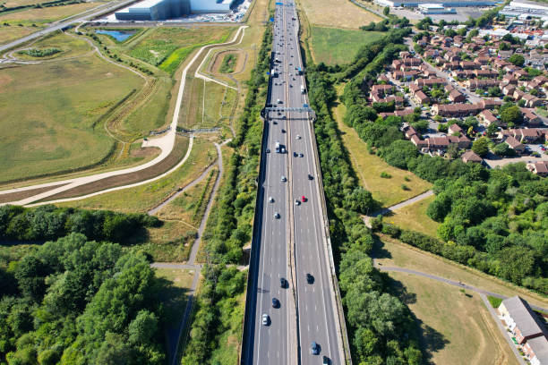 an aerial view of british motorways with traffic at luton town of england - escaping the rat race imagens e fotografias de stock