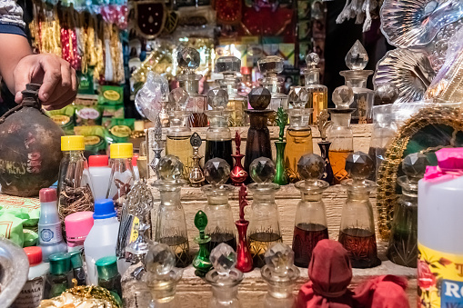 Hyderabad, India - September 2018: Glass bottles with traditional perfume and ittar on display for sale outside a shop in old Hyderabad.