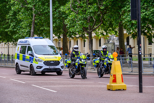 LONDON - May 18, 2022: Police motorcycles and van on The Mall, London
