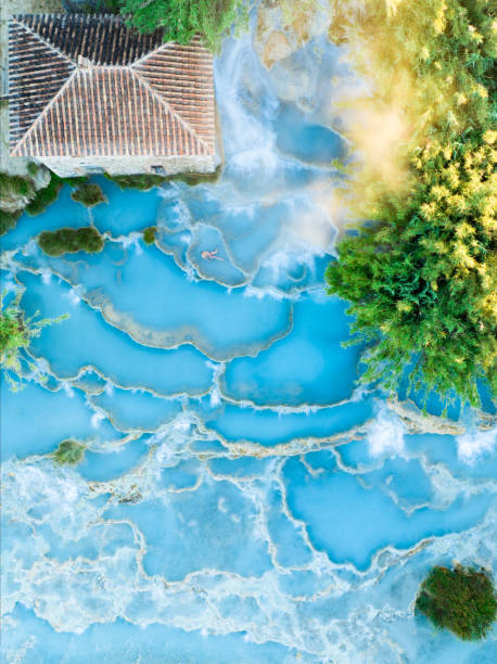 view from above, stunning aerial view of le cascate del mulino, a group of beautiful hot springs in the municipality of manciano, tuscany. - waterfall health spa man made landscape imagens e fotografias de stock