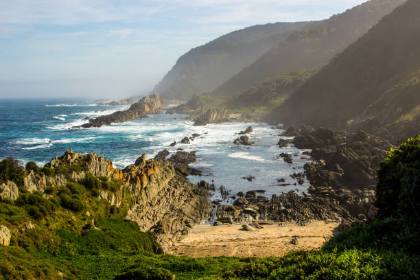 istock A small sheltered cove, hidden among the tall cliffs and rock 1408053520
