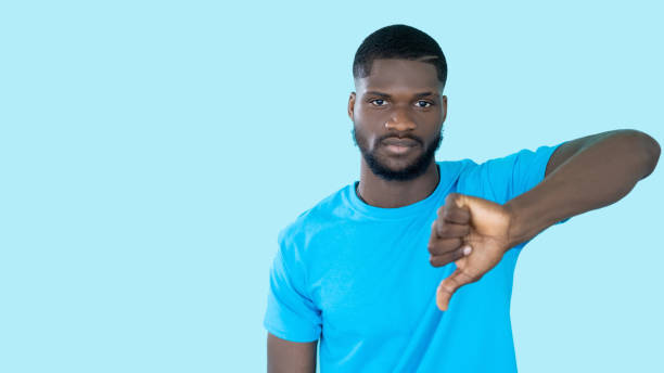 istock dislike gesture disapproval sign man thumb down 1408053864