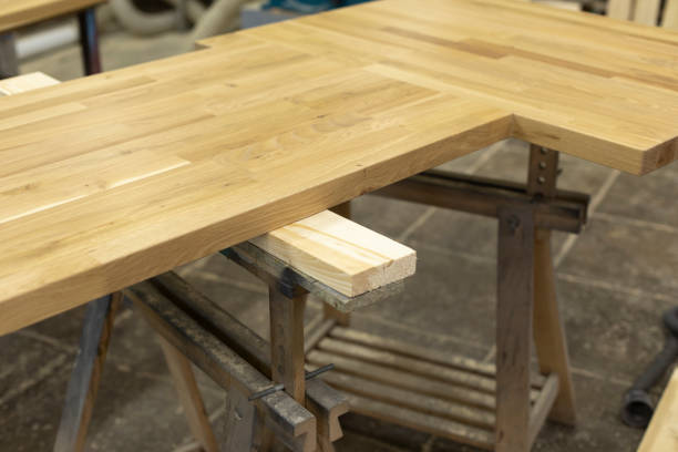 istock Wooden board on table. Joinery. Workbench for working with board. 1408054782