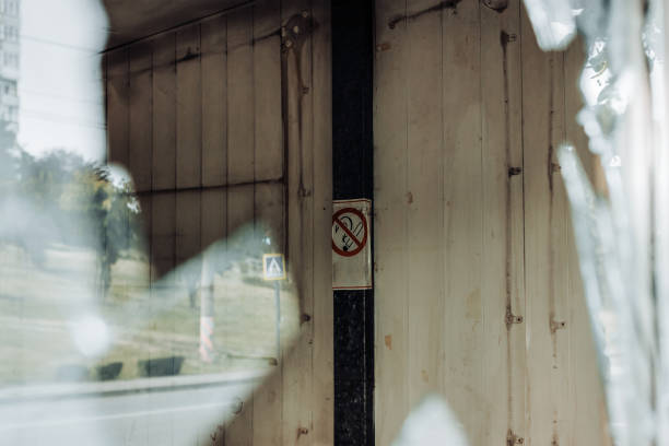 istock No smoking sign seen through a broken window 1408055091