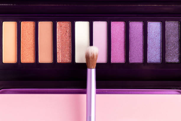 istock Colorful eye shadow palette on pink background 1408055283