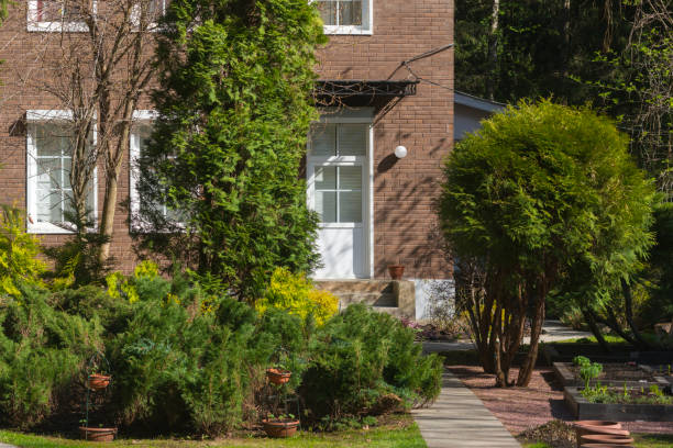 istock Private brick house with a beautiful garden in front of it 1408057705