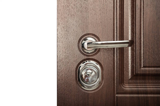 istock Close-up metal handle armor door and door lock on white background 1408057871