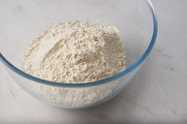 istock Flour in a glass bowl on a marble kitchen counter 1408058959