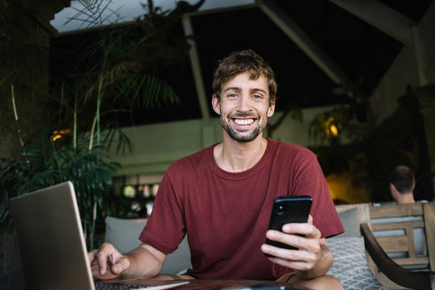 istock Happy millennial man pleased with new message 1408059461