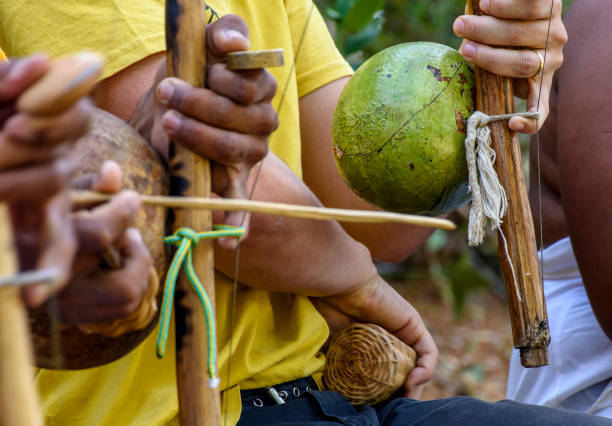 istock Musicians playing an instrument called berimbau 1408060997