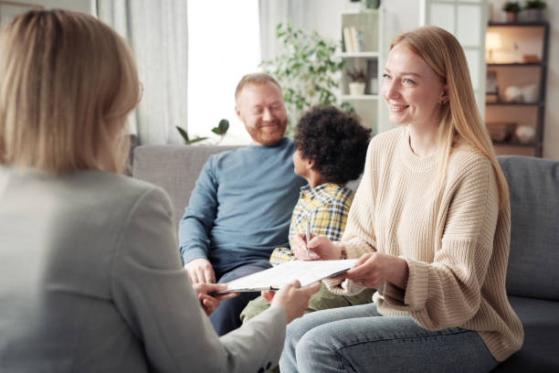 woman signing contract about adoption - domestic issues imagens e fotografias de stock