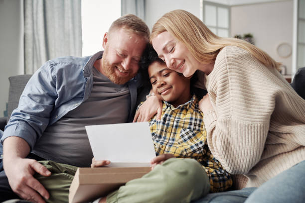 istock Happy parents officially adopting child 1408061776