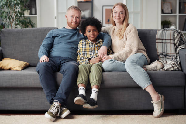istock Young couple with adoptive child 1408063573