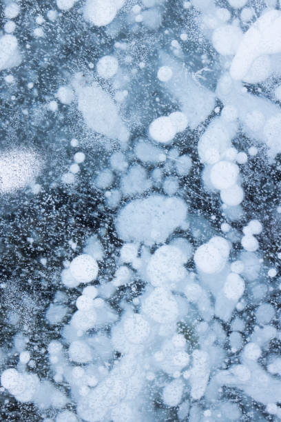 istock metano bubbles frozen inside the ice 1408065989