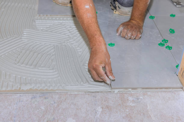 istock With home construction work, ceramic floor tiles are placed on an adhesive surface 1408068043