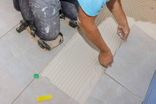 istock Tile adhesive is applied to glue-smeared floors when laying ceramic tiles 1408068045