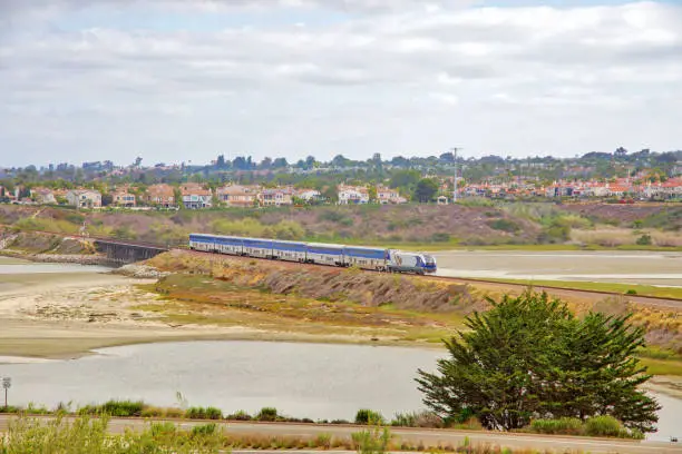 Amtrak Pacific Surfliner Train passing through the Lagoon at Encinitas.