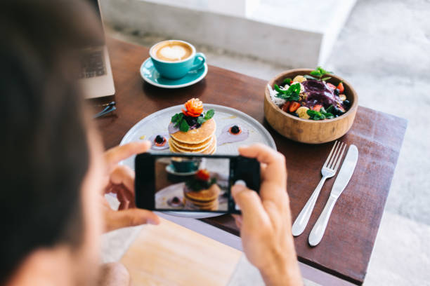 istock Anonymous man taking photo of breakfast set 1408069823