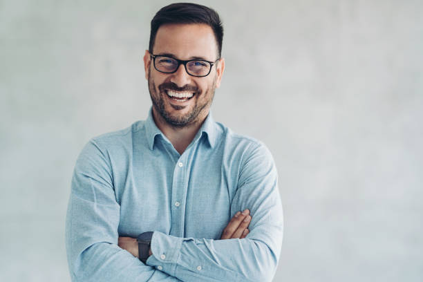 istock Cheerful businessman standing in the office 1408069946