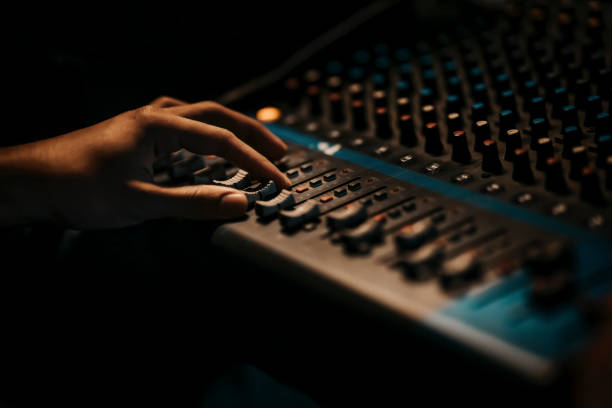 istock asian sports event crew working at backstage with control panel on stage lighting , sound system and lighting effect 1408070712