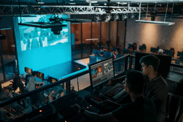 istock asian sports event crew working at backstage with control panel on stage lighting , sound system and lighting effect 1408070791
