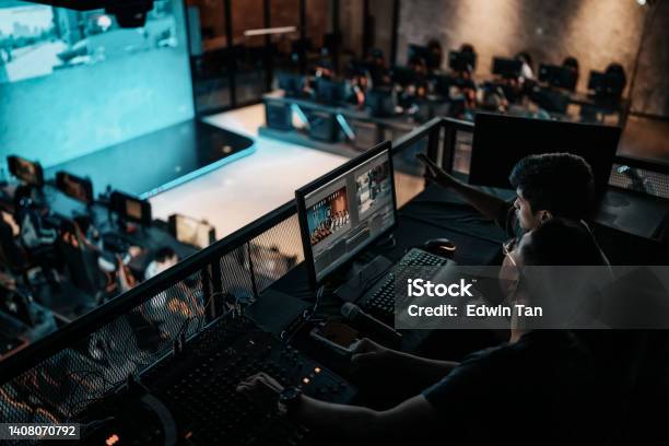 Asian Sports Event Crew Working At Backstage With Control Panel On Stage Lighting Sound System And Lighting Effect Stock Photo - Download Image Now