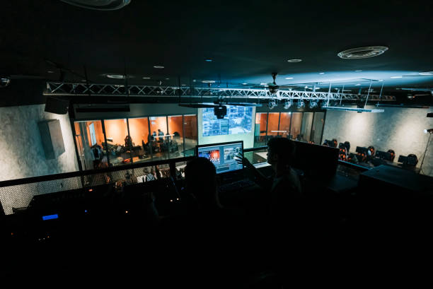 istock asian esports event crew working at backstage with control panel on stage lighting , sound system and lighting effect 1408070805