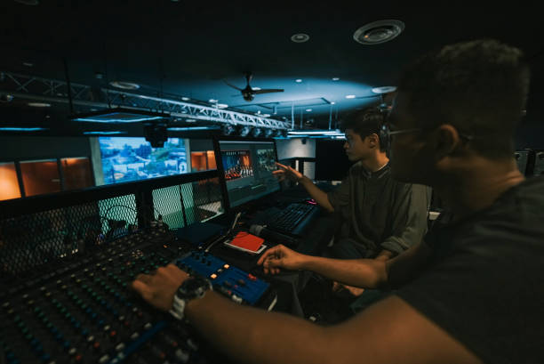 istock asian sports event crew working at backstage with control panel on stage lighting , sound system and lighting effect 1408070820