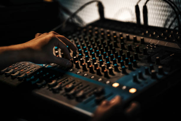 istock asian sports event crew working at backstage with control panel on stage lighting , sound system and lighting effect 1408071207