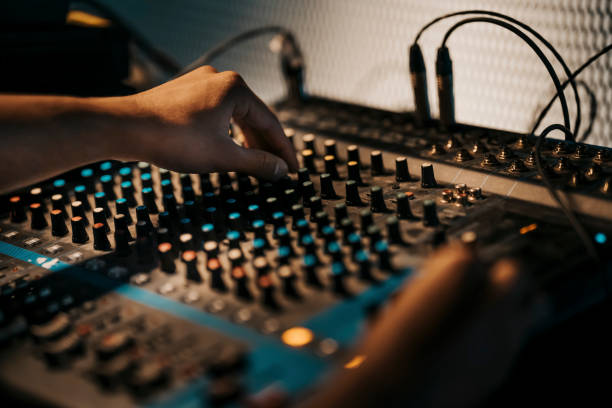 istock asian sports event crew working at backstage with control panel on stage lighting , sound system and lighting effect 1408071240