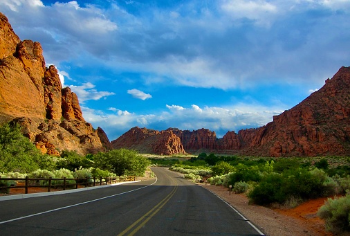 Stock photograph of long road leading towards Monument Valley as seen from Forrest Gump Point, Utah.