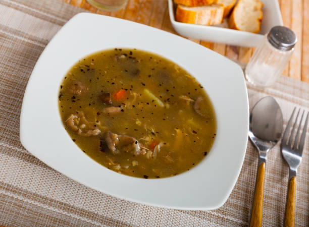 istock Soup with assorted mushrooms, vegetables and pork 1408072537