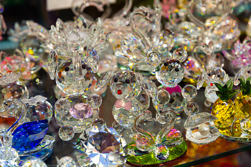 Bohemian glass figurines in showcase of souvenire shop