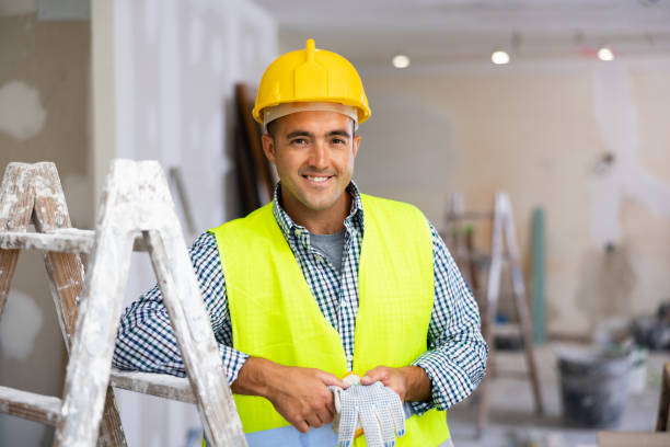 istock Portrait of positive man builder in construction site 1408072873