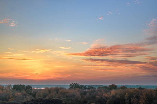 istock Beautiful sunset over the forest with beautiful sky. 1408073077