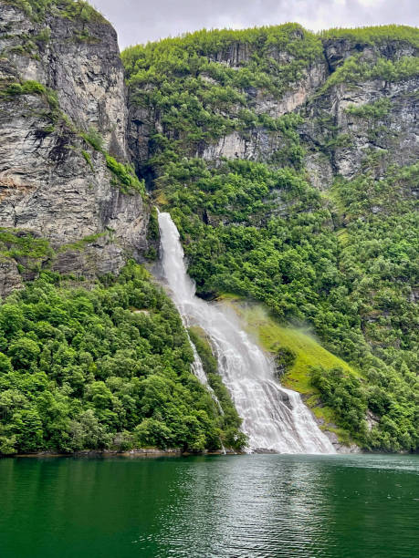 istock Beautiful waterfall in Geirangerfjord 1408077071
