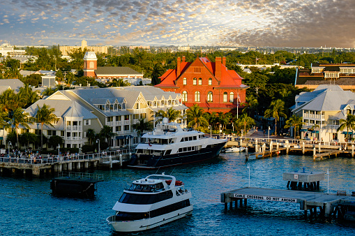 As the sun gets ready to set the golden hour in the Key West harbor gives a unique perspective of the small island on the Keys.