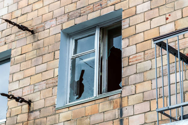 istock broken window of a residential building 1408078847