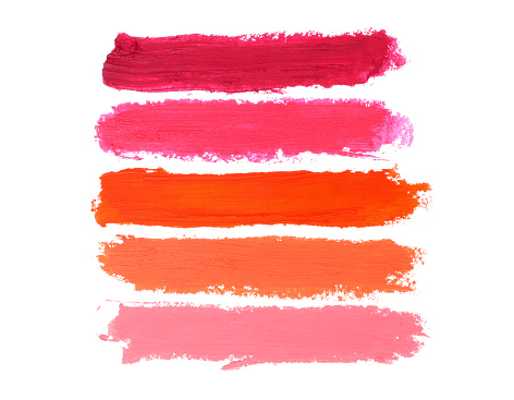 Color lipstick smears smudge on white background close-up